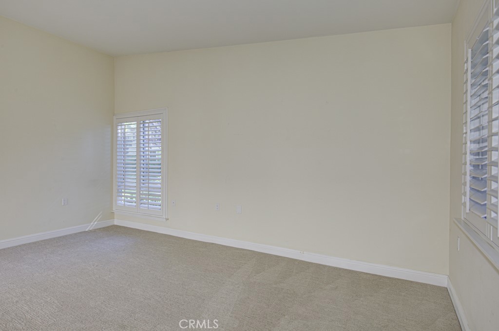 Another view of the living room. As an end-unit, this residence has an extra window in the living room. - 2 Via Castilla E, Laguna Woods CA 92637 - photo 6