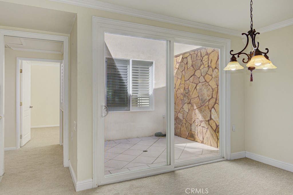 Dining area and central atrium. - 2 Via Castilla E, Laguna Woods CA 92637 - photo 12