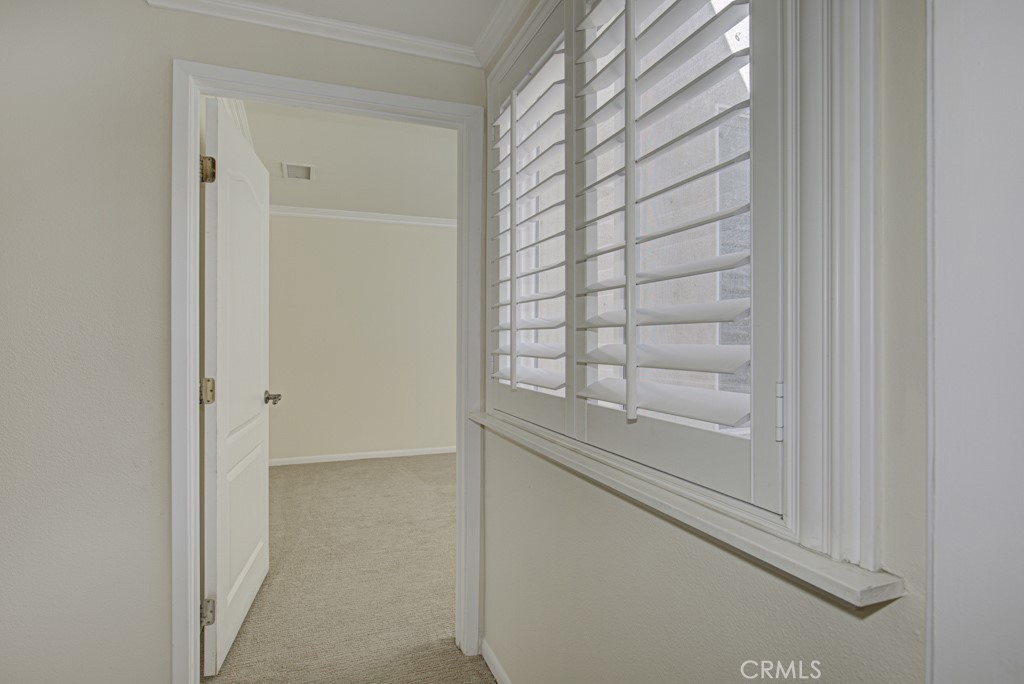 Entry to guest bedroom. Window at right looks into the central atrium. - 2 Via Castilla E, Laguna Woods CA 92637 - photo 14