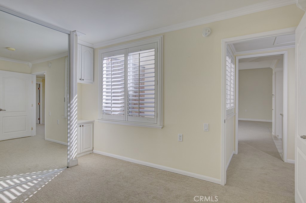 Another view of the guest bedroom. Window looks into the central atrium. - 2 Via Castilla E, Laguna Woods CA 92637 - photo 17