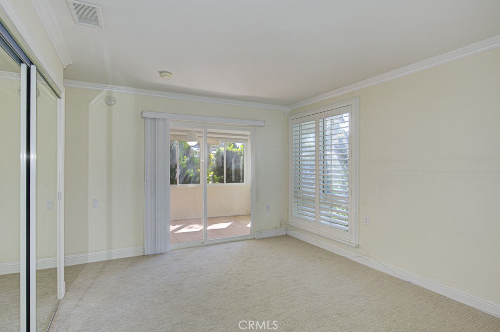 Another view of the primary bedroom suite looking towards the enclosed front patio. - 2 Via Castilla E, Laguna Woods CA 92637 - photo 24