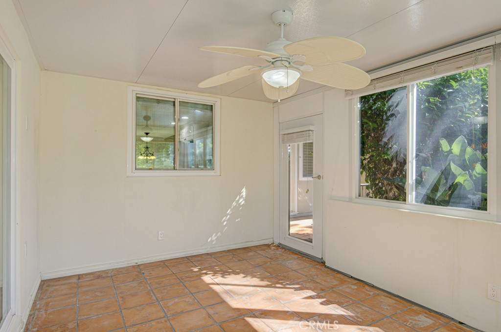 Enclosed front patio. This area, accessible from the primary bedroom could serve as an arts and crafts studio, sewing ro - 2 Via Castilla E, Laguna Woods CA 92637 - photo 27