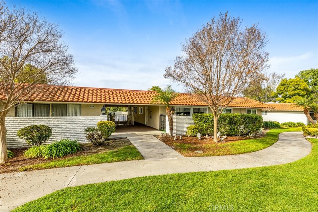 NO STEPS, walk right in from the carport area. - 2096 Ronda Granada O, Laguna Woods CA 92637 - photo 1