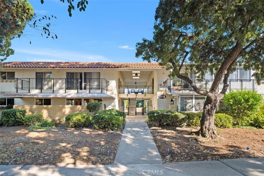 Front View - First floor location with no one below and no stairs to the parking in Carport - 2118 Via Puerta #D, Laguna Woods CA 92637 - photo 1