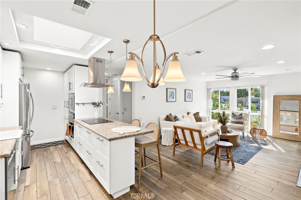Bright and open concept kitchen and living area - 2119 Via Puerta #U, Laguna Woods CA 92637 - photo 1