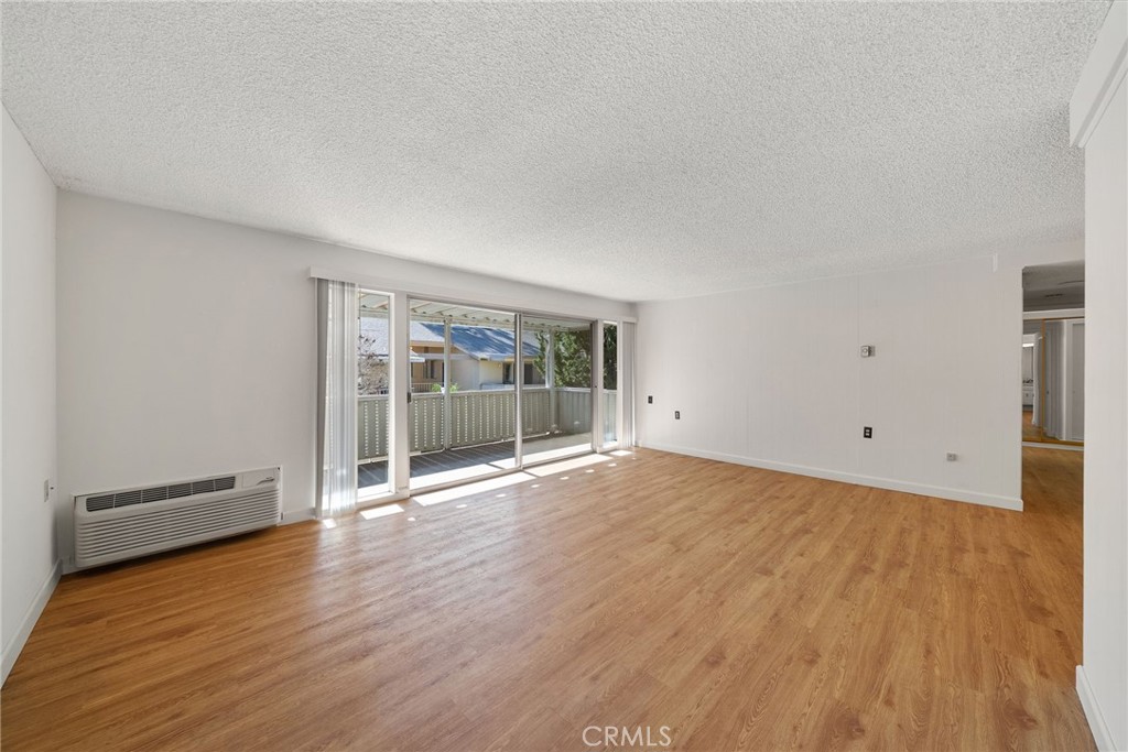 Spacious entrance and living room with covered balcony - 225 Avenida Majorca N, Laguna Woods CA 92637 - photo 2