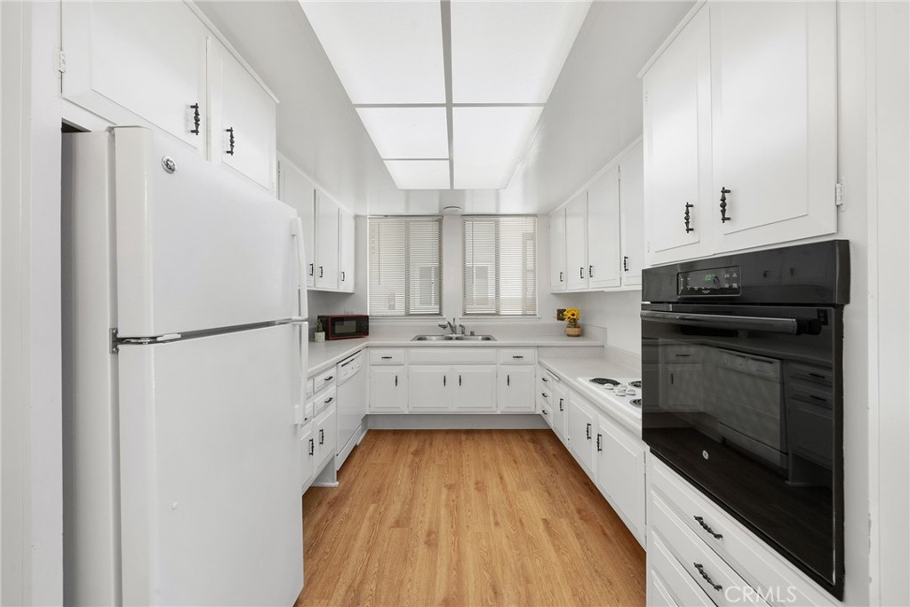The kitchen is fully equipped with electric appliances and skylights above for an open feel - 225 Avenida Majorca N, Laguna Woods CA 92637 - photo 8