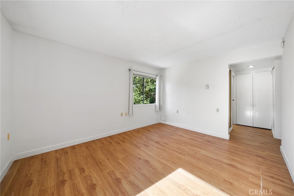 POV: Primary bedroom looking out to the hallway - 225 Avenida Majorca N, Laguna Woods CA 92637 - photo 14