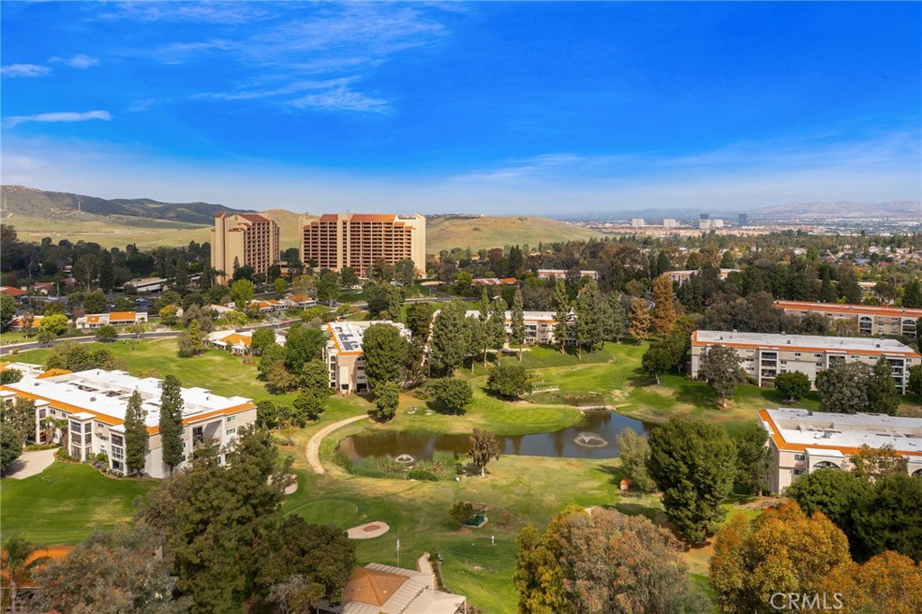 Sweeping aerial view of Laguna Woods Village, a private 55+ community spanning approximately 2,100 acres of rolling hill - 225 Avenida Majorca N, Laguna Woods CA 92637 - photo 20