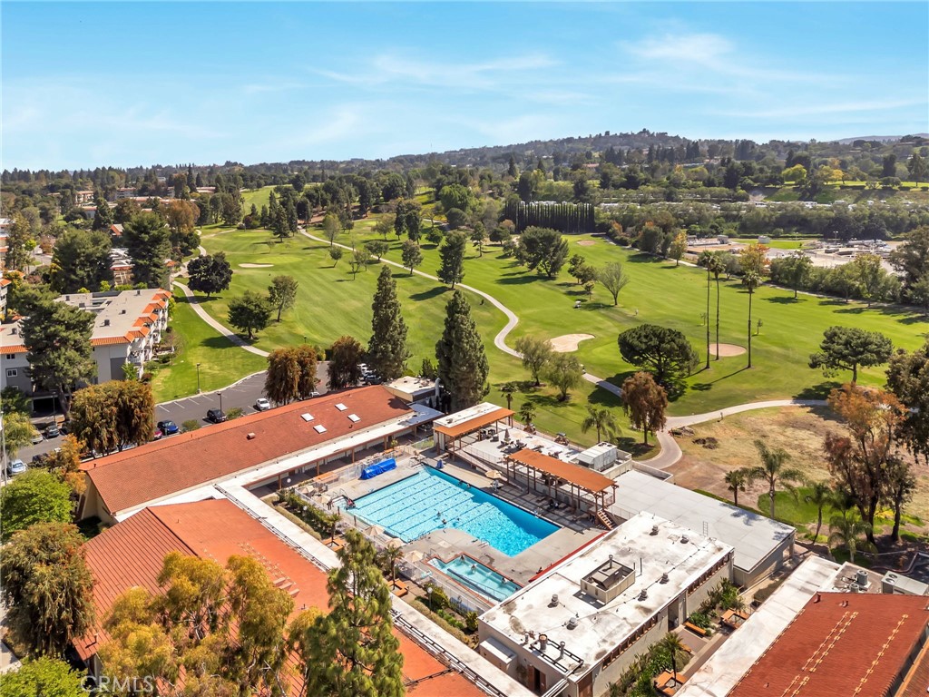 Aerial view of a community pool and hot pool beside the golf course. Laguna Woods Village offers five pools, four hot po - 225 Avenida Majorca N, Laguna Woods CA 92637 - photo 25