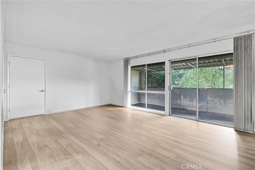 Great room and view of entrance - 2329 Via Mariposa W O, Laguna Woods CA 92637 - photo 1
