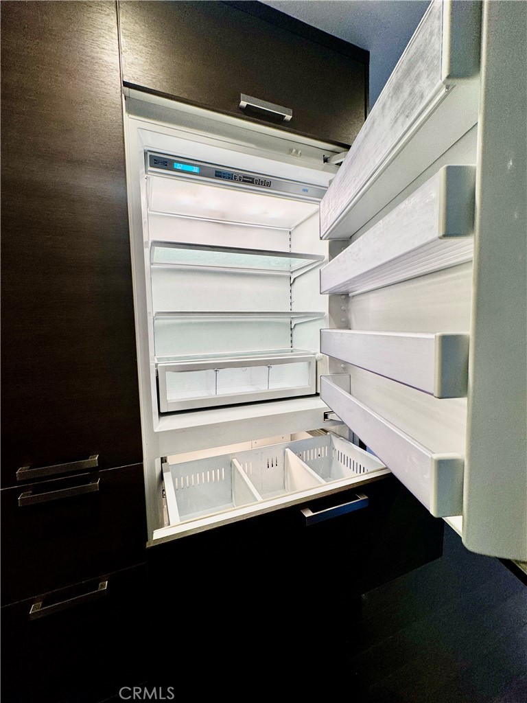 The statement-making built-in refrigerator offers generous storage and a high-end, designer finish, ideal for the home c - 2346 Via Mariposa W A, Laguna Woods CA 92637 - photo 12