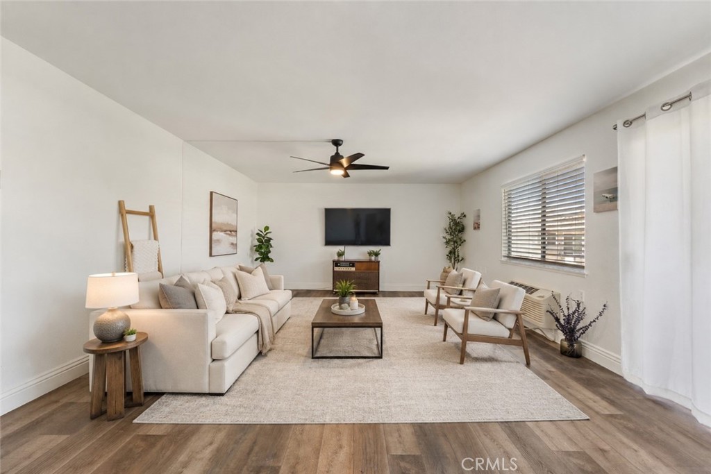 Expansive living room virtually staged - 2389 Via Mariposa W 2A, Laguna Woods CA 92637 - photo 1