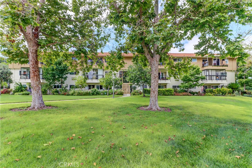 Front Entrance to 2394 Building Near Golfcourse - 2394 Via Mariposa W 1D, Laguna Woods CA 92637 - photo 1