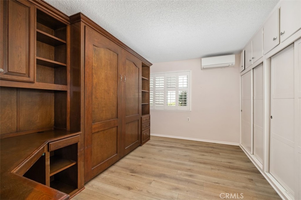 Murphy BedMurphy bed featuring an integrated desk, drawers, and built-in shelving unit. - 270 Avenida Sevilla D, Laguna Woods CA 92637 - photo 28