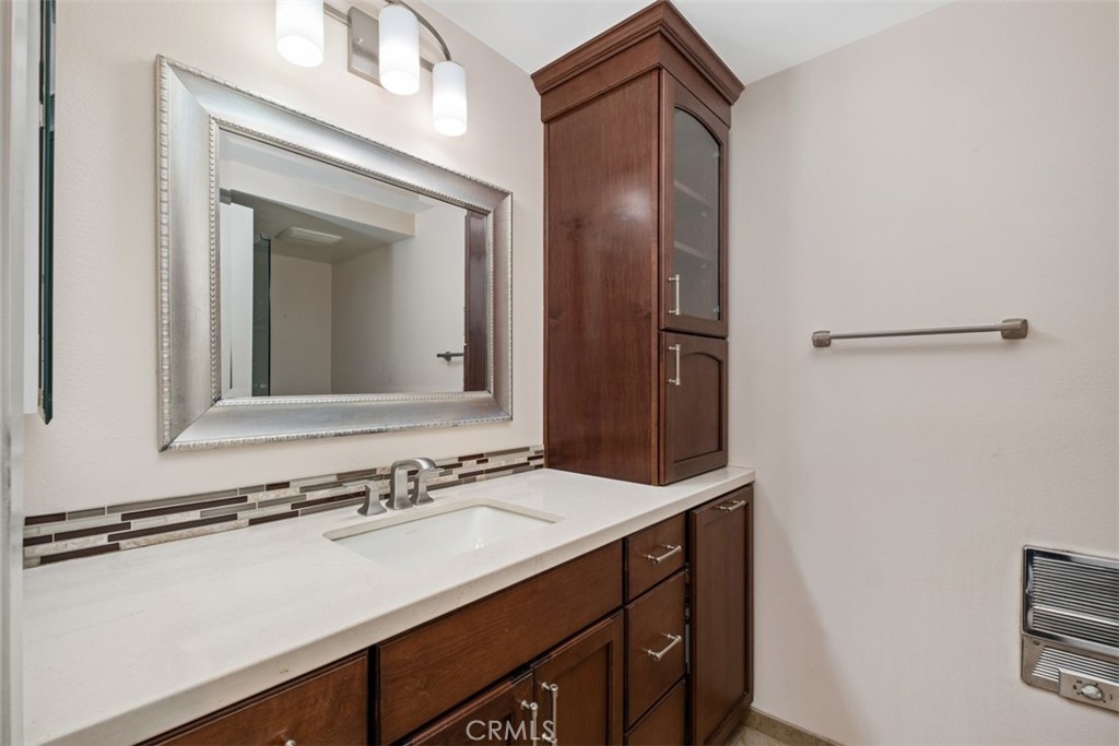Modern hallway bathroom featuring ample built-in storage solutions and a clean, functional layout. - 270 Avenida Sevilla D, Laguna Woods CA 92637 - photo 30