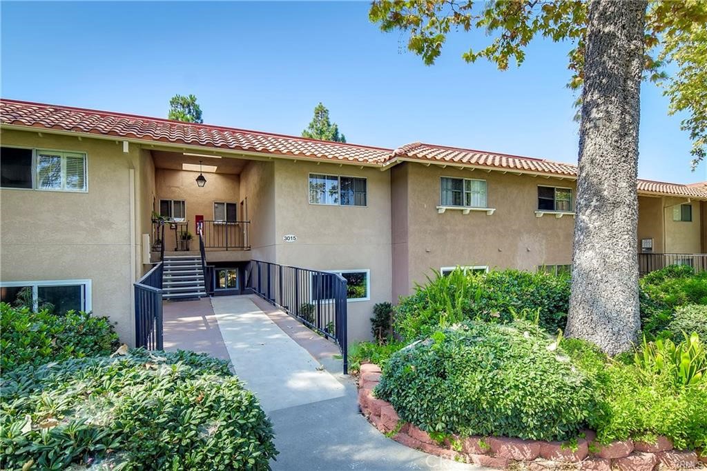 Front of 3015. 9 Steps Down to Condo. - 3015 Via Buena Vista B, Laguna Woods CA 92637 - photo 1