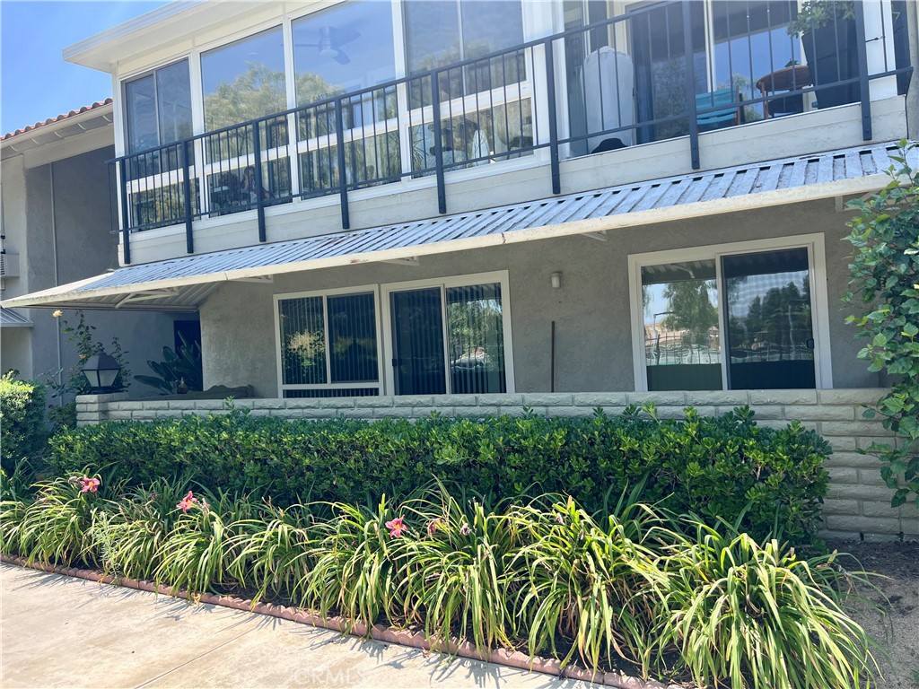 Lower unit has 2 sliding doors to covered large patio, windows have been replaced - 3026 Calle Sonora A, Laguna Woods CA 92637 - photo 1