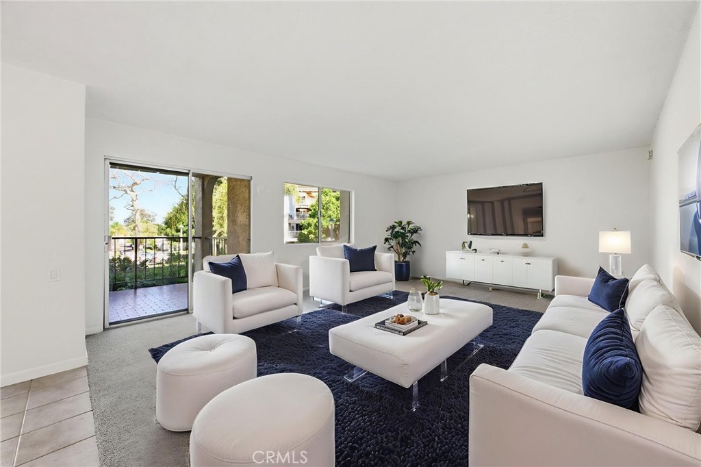 Virtually staged living area - 3243 San Amadeo 1F, Laguna Woods CA 92637 - photo 1