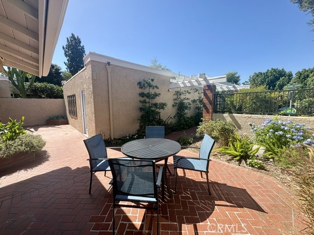 Another view of the front courtyard looking back towards the garage and front gate. - 3386 Punta Alta A, Laguna Woods CA 92637 - photo 3