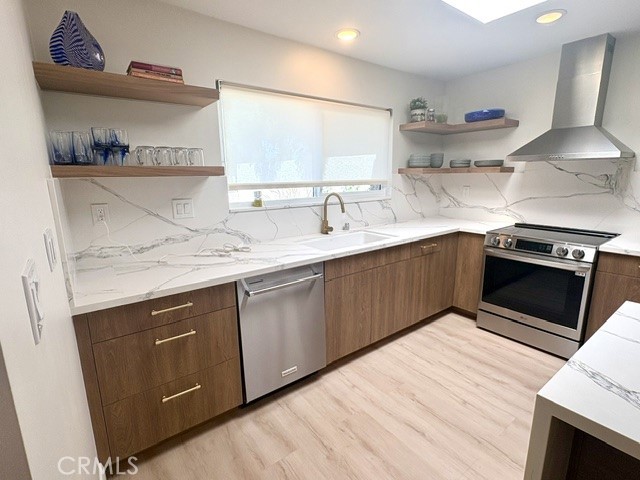 Additional kitchen features include pots and pans drawers, self-closing drawers and built-in trash/recycling. - 3386 Punta Alta A, Laguna Woods CA 92637 - photo 15