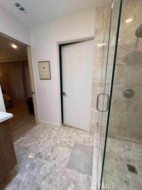 Door opens to walk-in closet in primary bathroom. - 3386 Punta Alta A, Laguna Woods CA 92637 - photo 21