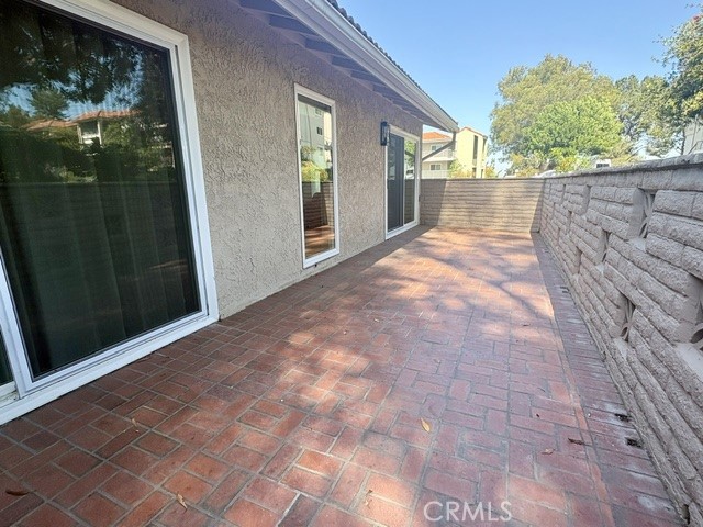 Private rear patio is accessible from the living room and the primary bedroom suite. - 3386 Punta Alta A, Laguna Woods CA 92637 - photo 27