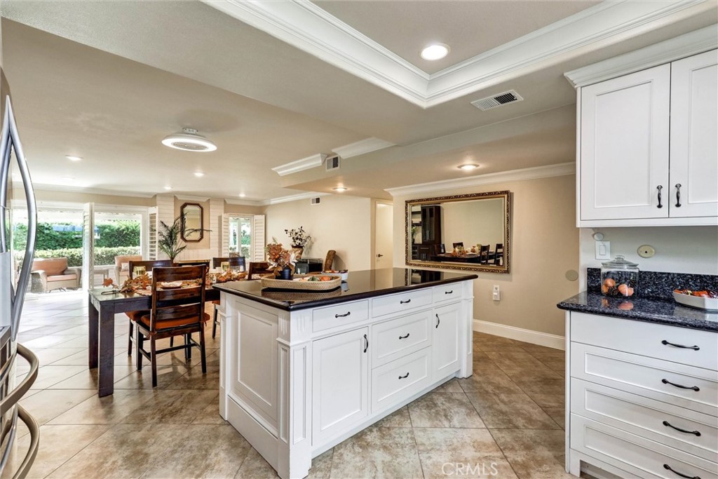 Large kitchen island opens to the living area - 3400 Punta Alta A, Laguna Woods CA 92637 - photo 8
