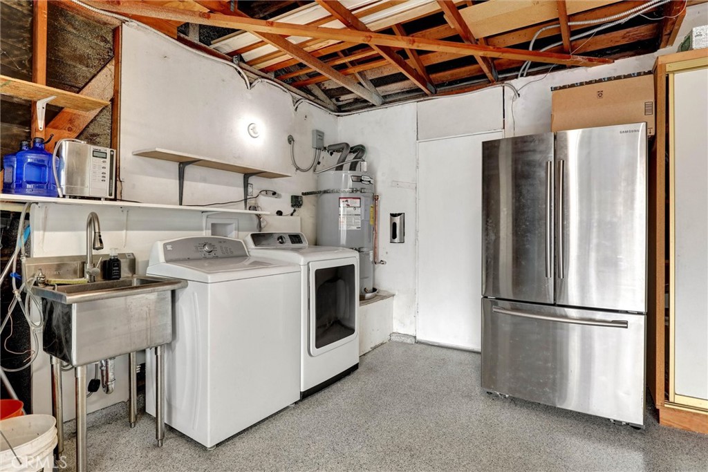 Convenient laundry with a utility sink and a new water heater - 3400 Punta Alta A, Laguna Woods CA 92637 - photo 39