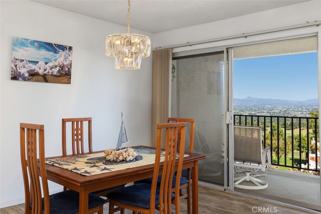 Eagle's eye view of the Saddleback Valley from your dining room and access to the spacious balcony. - 4013 Calle Sonora Oeste Unit 2E, Laguna Woods CA 92637 - photo 8