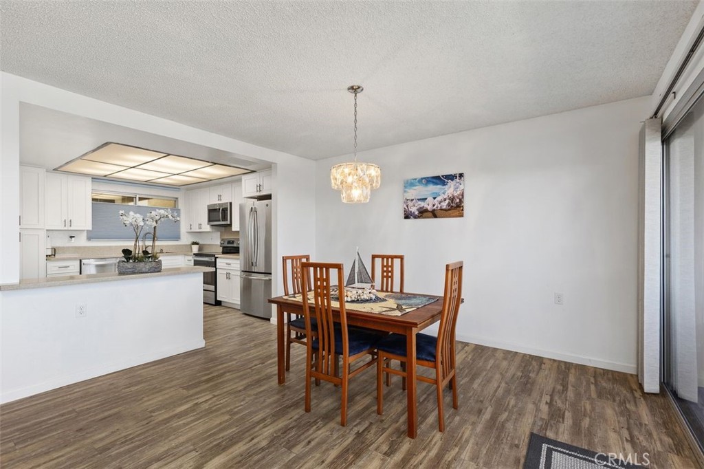 Dining room open to kitchen. - 4013 Calle Sonora Oeste Unit 2E, Laguna Woods CA 92637 - photo 12