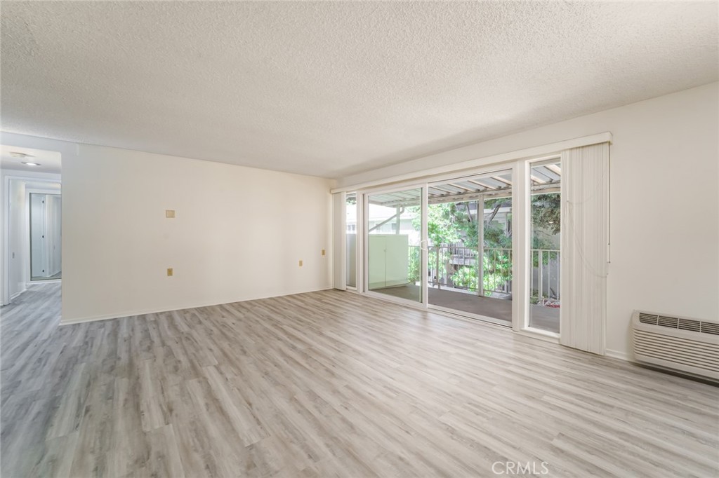 Large Living room with oversized sliding glass door. - 476 Calle Cadiz O, Laguna Woods CA 92637 - photo 5