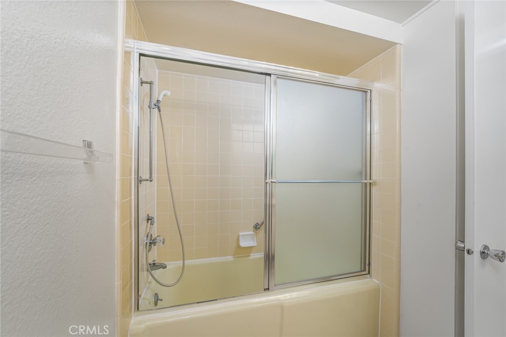 Cast Iron soaking tub with shower. - 476 Calle Cadiz O, Laguna Woods CA 92637 - photo 20