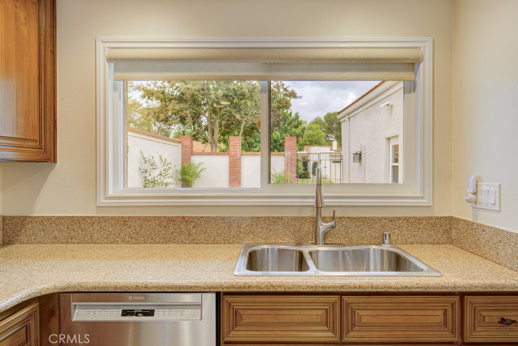 View of the front courtyard from the kitchen window. - 5016 Jardin, Laguna Woods CA 92637 - photo 16