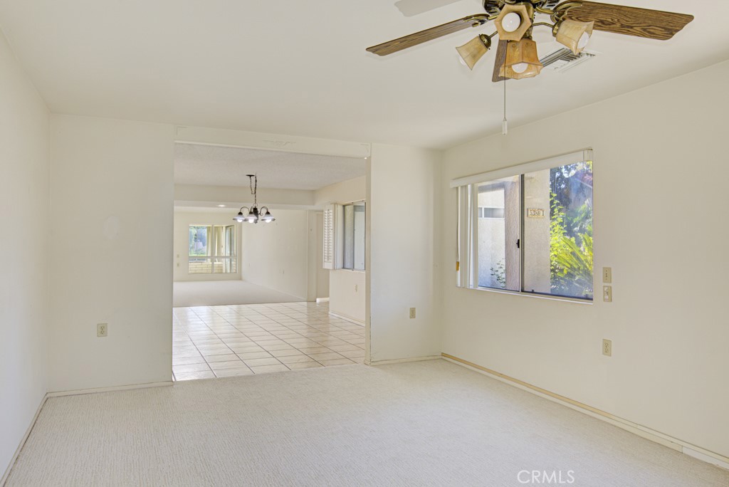 Another view of the bonus room looking back towards the dining area and living room in the bacckground. - 5380 Avenida Sosiega B, Laguna Woods CA 92637 - photo 14