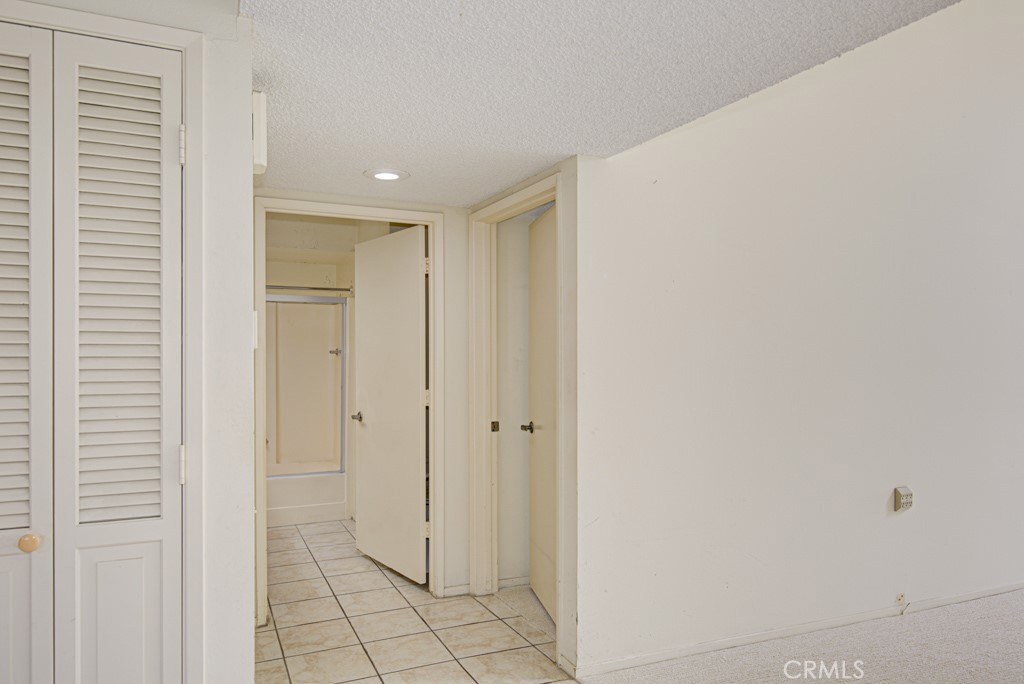 Entry to the left-side bedroom and bathroom. - 5380 Avenida Sosiega B, Laguna Woods CA 92637 - photo 15