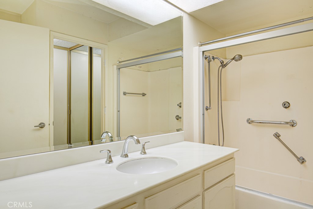 Left side bathroom has a skylight and tub/shower combo. - 5380 Avenida Sosiega B, Laguna Woods CA 92637 - photo 19
