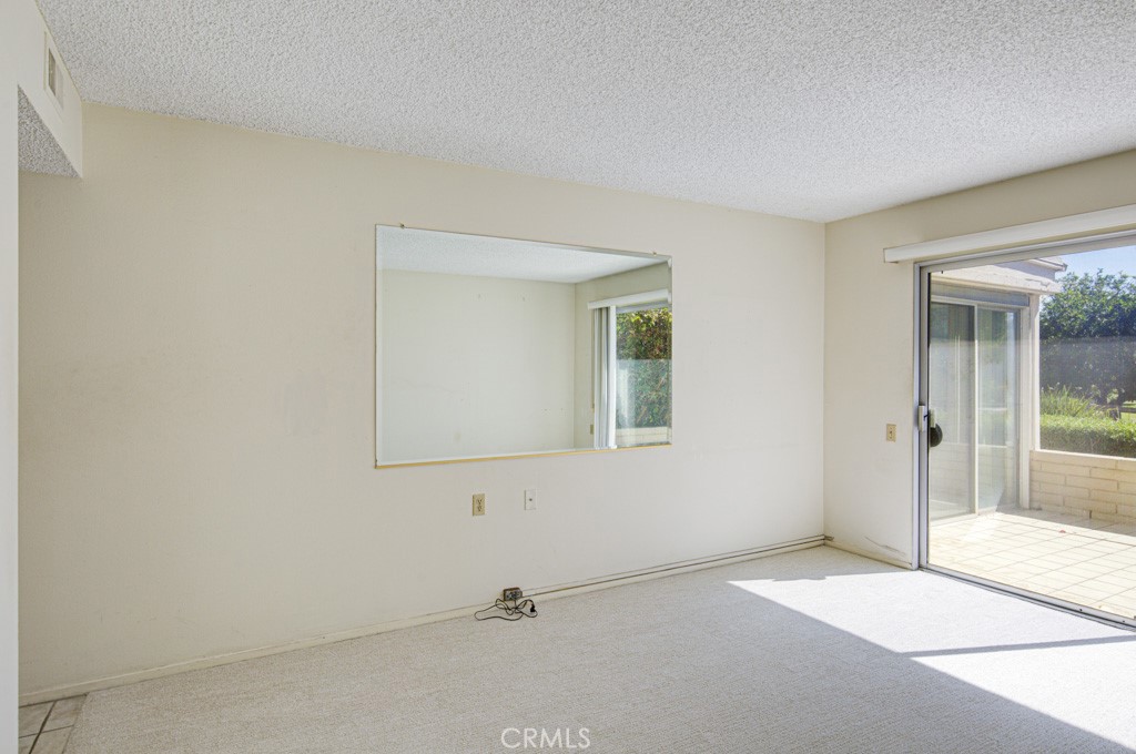 Right side bedroom has direct access to the open rear patio area. - 5380 Avenida Sosiega B, Laguna Woods CA 92637 - photo 23