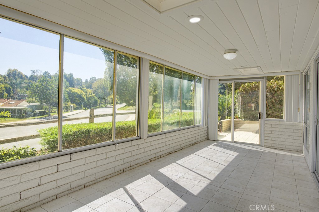 Expansive enclosed rear patio with direct access to the small adjacent open patio. - 5380 Avenida Sosiega B, Laguna Woods CA 92637 - photo 26