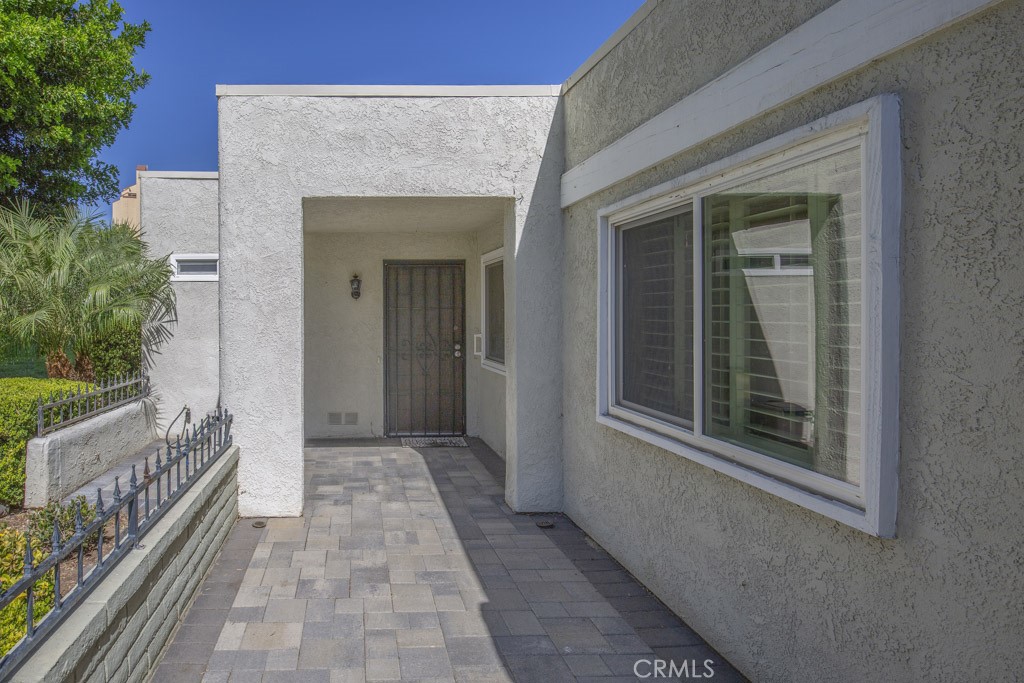 Path to the front door. - 5516 Paseo Del Lago W A, Laguna Woods CA 92637 - photo 2