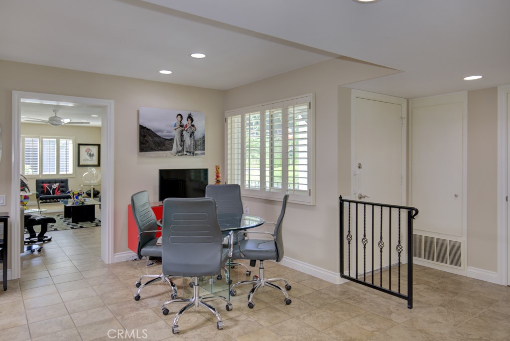 Dining area with the entry door on the right and entry to the bonus room at left. - 5516 Paseo Del Lago W A, Laguna Woods CA 92637 - photo 6
