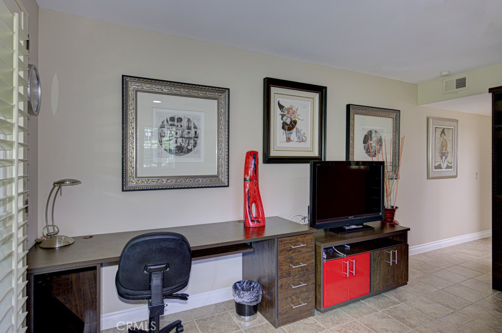 Built-in desk in left-side bedroom suite. - 5516 Paseo Del Lago W A, Laguna Woods CA 92637 - photo 23