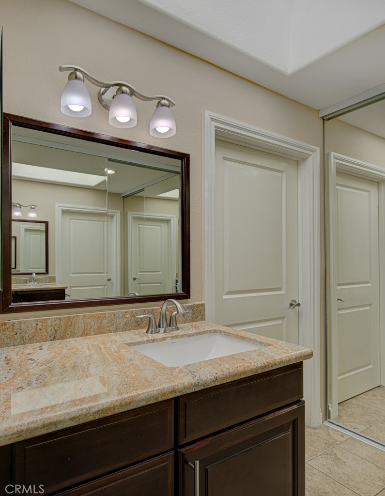 Left-side bathroom. - 5516 Paseo Del Lago W A, Laguna Woods CA 92637 - photo 25