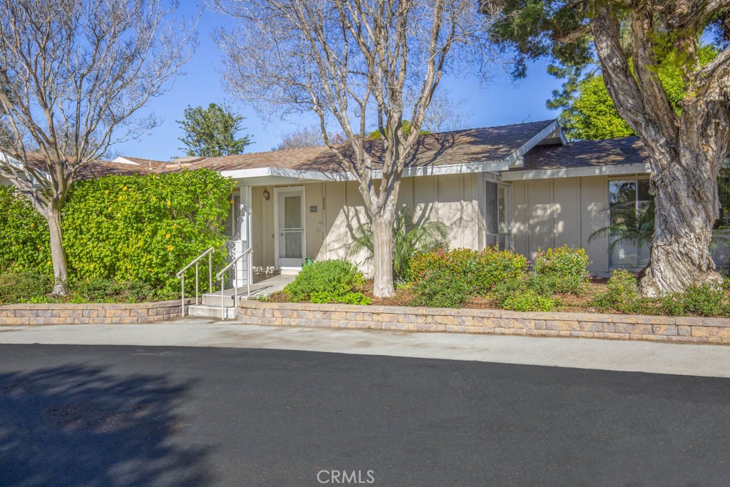 Park at your front door! Enjoy the HOA maintained landscaping and mature trees. - 552 Avenida Sevilla B, Laguna Woods CA 92637 - photo 1