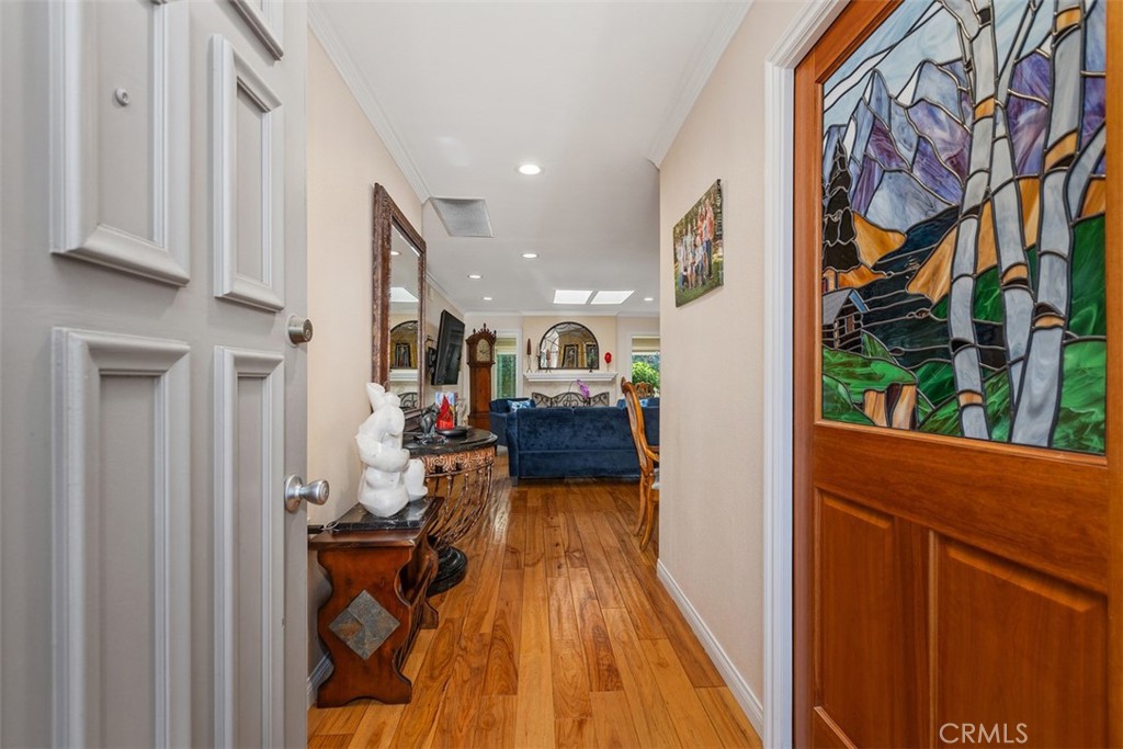 ENTRY WAY SHOWING STAINED GLASS POCKET DOOR INTO KITCHEN - 5522 Via La Mesa B, Laguna Woods CA 92637 - photo 11