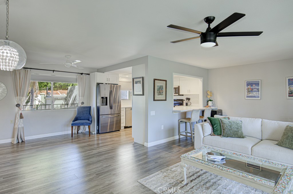 Kitchen wall has been opened up to the living room with a service bar - 5531 Via La Mesa O, Laguna Woods CA 92637 - photo 6