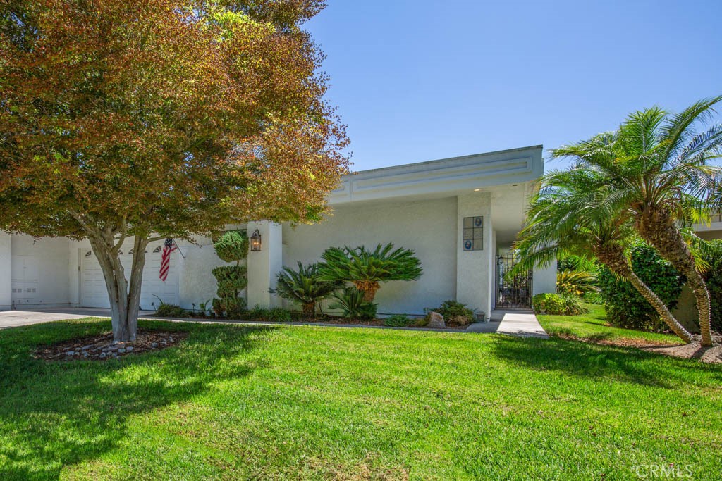 Another view of the front of the property showing path to the front entry gate. - 5553 Rayo Del Sol B, Laguna Woods CA 92637 - photo 2