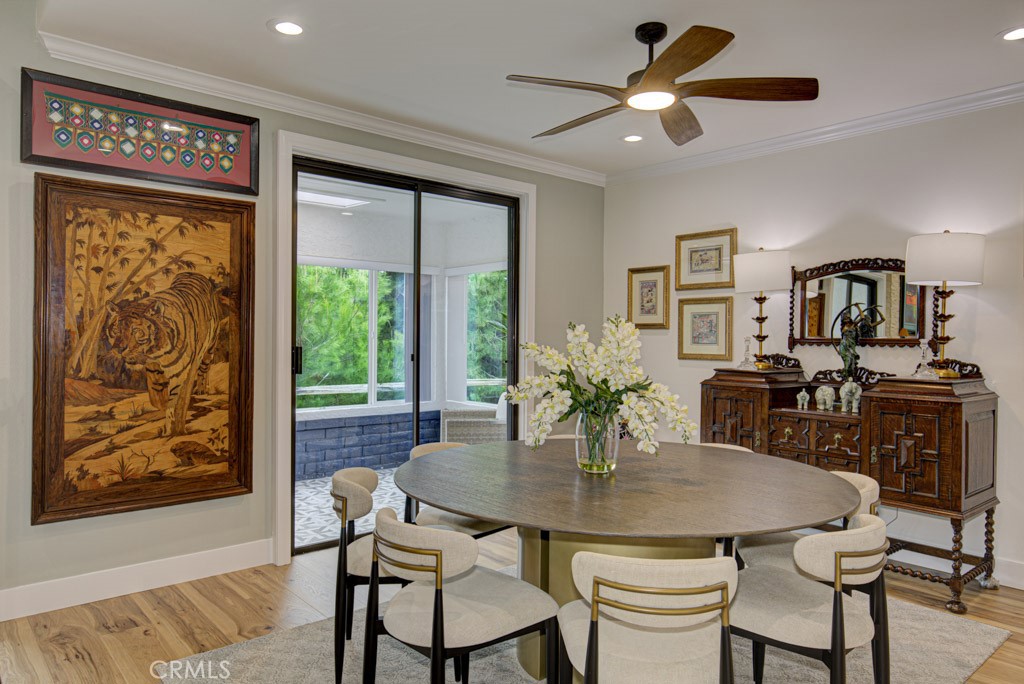 Dining room easily accommodates a large dining table. Note the separate entrance to the enclosed covered rear patio. - 5553 Rayo Del Sol B, Laguna Woods CA 92637 - photo 11