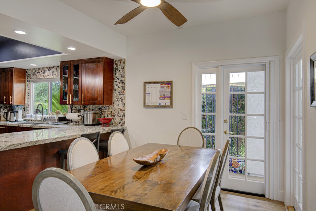 Another view of the kitchen's breakfast nook. There is also a breakfast bar at left. - 5553 Rayo Del Sol B, Laguna Woods CA 92637 - photo 22