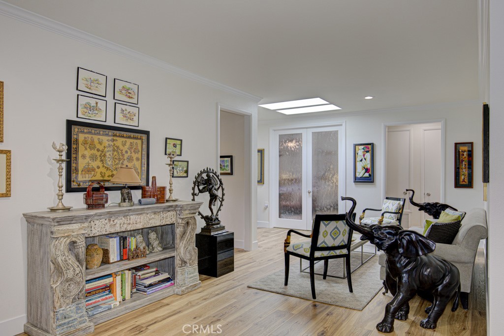 Another view of the entry foyer. French doors at center open to the primary bedroom suite. Open doorway at right leads t - 5553 Rayo Del Sol B, Laguna Woods CA 92637 - photo 23